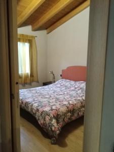 Ένα ή περισσότερα κρεβάτια σε δωμάτιο στο Casa Nonni +4 φωτογραφίες
