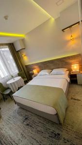 Letto o letti in una camera di RG Boutique Hotel