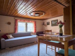 a living room with a couch and a table at Chaloupka Letohrad in Letohrad