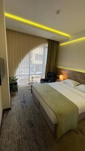 Postel nebo postele na pokoji v ubytování RG Boutique Hotel