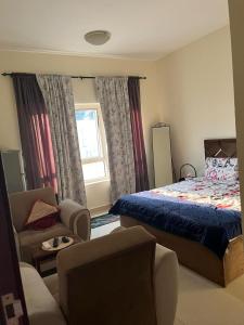 Ένα ή περισσότερα κρεβάτια σε δωμάτιο στο Pure zamzam Guest House At Al nahda Sharjah Dubai Border-FAMILY ONLY