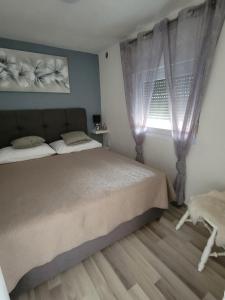 Postel nebo postele na pokoji v ubytování Apartments Lanterna Ražanac