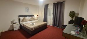 Postel nebo postele na pokoji v ubytování Hotel Garni