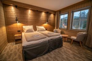 Postel nebo postele na pokoji v ubytování Matarengi Lodge + 21 fotografií