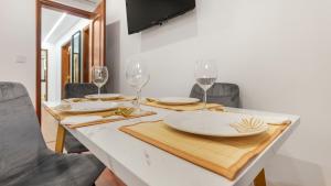Μια τηλεόραση ή/και κέντρο ψυχαγωγίας στο Top Apartment
