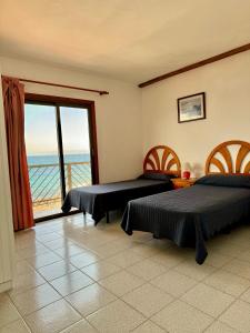 Postel nebo postele na pokoji v ubytování Mangos Mar D