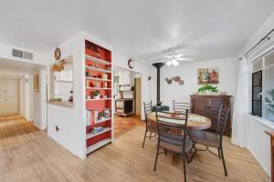 a kitchen and dining room with a table and chairs at Famed Plaza Oasis 1 mile away, King Bed, Office, Foosball in Santa Fe