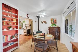 a kitchen and dining room with a table and chairs at Famed Plaza Oasis 1 mile away, King Bed, Office, Foosball in Santa Fe