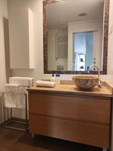 a bathroom with a sink and a large mirror at Seaside Beach-Lounge Alicante in El Campello