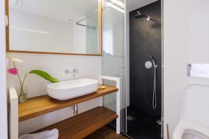 a bathroom with a sink and a shower at CANTINHO D'AVÓ - Apúlia in Areia +42 photos