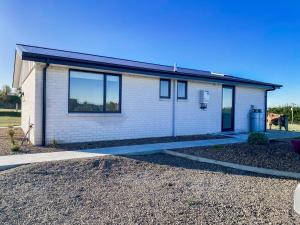 a house with a driveway in front of it at Country Cottage in Sefton