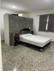 a bedroom with a bed in a room at Casa pé na areia in Vila Velha