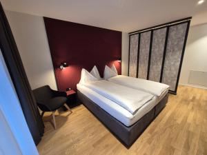 Postel nebo postele na pokoji v ubytování CENTRINO Apartments