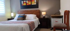 Postel nebo postele na pokoji v ubytování Hostal del Aguila