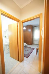 an open door to a room with a bathroom at Διαμέρισμα με κήπο στην Χλόη Καστοριάς in Kastoria +16 photos