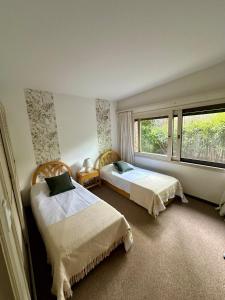 Postel nebo postele na pokoji v ubytování Amplia casa divina zona