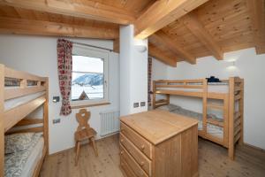 A bed or beds in a room at Casa Chatrian