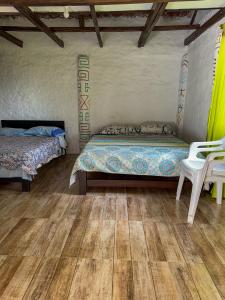 Postel nebo postele na pokoji v ubytování Hostal Pachamama