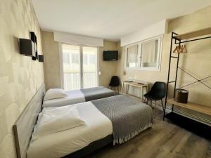 TV a/nebo společenská místnost v ubytování Hôtel Le Littoral - Berck sur Mer