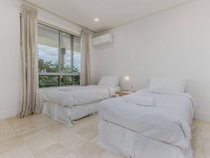Ένα ή περισσότερα κρεβάτια σε δωμάτιο στο Seabreeze Family Suite - Santai 203 +9 φωτογραφίες