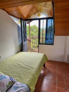 Postel nebo postele na pokoji v ubytování Hostal Pachamama