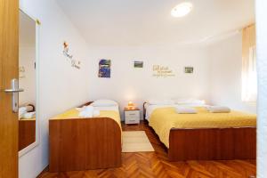 Posteľ alebo postele v izbe v ubytovaní Apartments Nadica