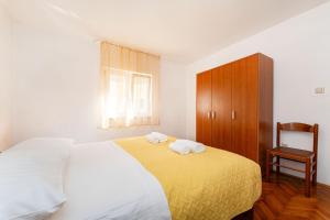 Posteľ alebo postele v izbe v ubytovaní Apartments Nadica