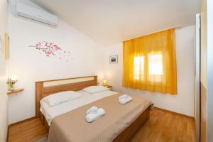 Posteľ alebo postele v izbe v ubytovaní Apartments Nadica