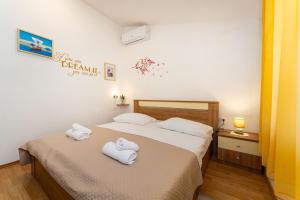 Posteľ alebo postele v izbe v ubytovaní Apartments Nadica