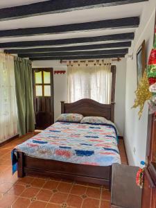 Postel nebo postele na pokoji v ubytování Hostal Pachamama