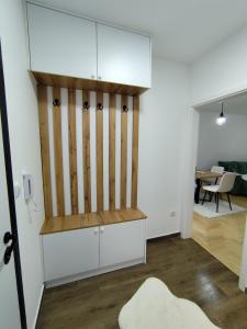 a room with a white cabinet and a table at Stan na dan Lane in Pale +8 photos