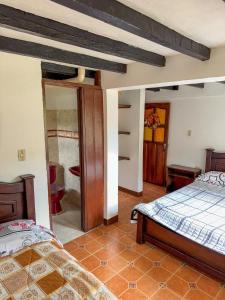Postel nebo postele na pokoji v ubytování Hostal Pachamama