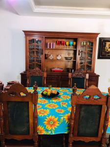 a dining room with a table and two chairs at Pousada Bella Maré in Goiana +30 photos