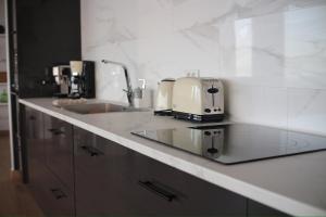 a toaster sitting on a counter in a kitchen at Villa Olimonte in Valverde +34 photos
