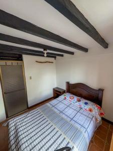 Postel nebo postele na pokoji v ubytování Hostal Pachamama
