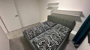 two beds sitting in a room with at Apartmány pod Chočom, Dolný Kubín in Vyšný Kubín