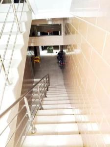 a staircase in a building with a motorcycle on it at Résidence Ahydeney in Abidjan