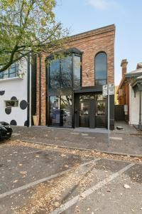 a brick building with a sign in front of it at Cozy Stays - Private Rooms in Adelaide CBD with Shared Facilities in Adelaide