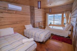Rúm í herbergi á Hotel Boutique Antukenu