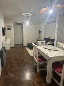 a living room with a table and a couch at Carlis Home in Cordoba
