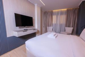 TV a/nebo společenská místnost v ubytování Remal Pyramids Hotel + 37 fotografií