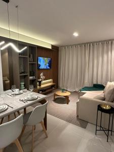 a living room with a couch and a table at ER1208 - Apartamento aconchegante em São Luís in São Luís