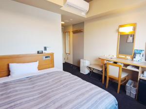 Postel nebo postele na pokoji v ubytování Hotel Route-Inn Mooka + 27 fotografií