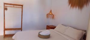 Postel nebo postele na pokoji v ubytování Pratama Guest House