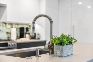 a kitchen sink with a potted plant on a counter at Large 3 BR - Sleep 8, Gourmet Kitchen, Beautiful Master, Large Balcony, Amazing Views! in Park City +38 photos