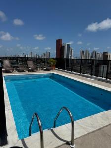a swimming pool on the roof of a building at Paraíso em Tambauzinho in João Pessoa