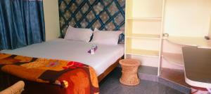 Ένα ή περισσότερα κρεβάτια σε δωμάτιο στο Sai Ram Home Stay