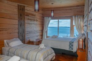 Postel nebo postele na pokoji v ubytování Hotel Boutique Antukenu