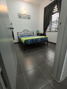 Postel nebo postele na pokoji v ubytování Homestay faleeq