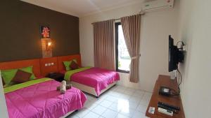 Yokima Beach Hotel TV 또는 엔터테인먼트 센터
